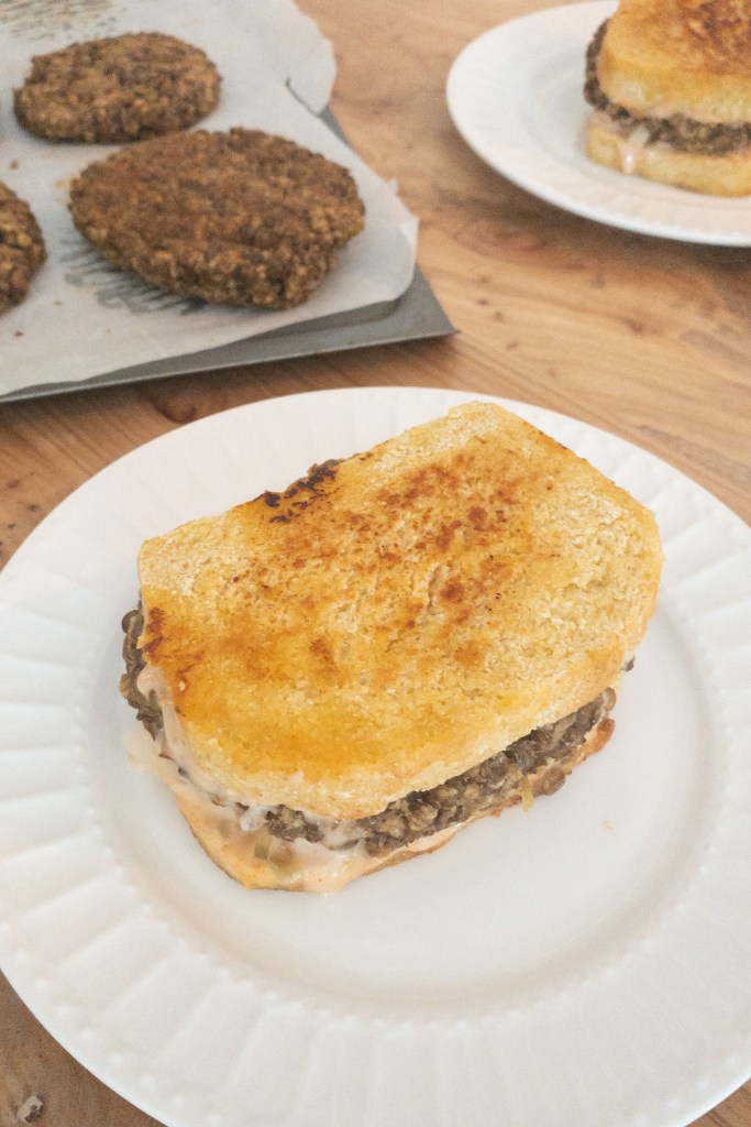 Vegan meaty lentil frisco melt made using lentils, frisco sauce, and onions pressed on a hot pan for a crispy golden outside with a tasty savory center.